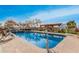 Enjoy a backyard oasis with a sparkling pool, cascading waterfall, and a relaxing hot tub at 5607 E Enrose St, Mesa, AZ 85205