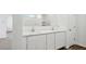 Bathroom featuring double sinks, marble countertop, and white cabinets at 5772 E Axle Ln, San Tan Valley, AZ 85140