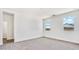 Clean bedroom with new carpet and a large window for ample natural light at 5772 E Axle Ln, San Tan Valley, AZ 85140