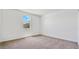 Well-lit bedroom with neutral carpet and a view from the window at 5772 E Axle Ln, San Tan Valley, AZ 85140