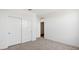 Carpeted bedroom with access to the bathroom and a double door closet at 5772 E Axle Ln, San Tan Valley, AZ 85140