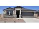 Beautiful single-story home featuring a two-car garage and desert landscaping at 5772 E Axle Ln, San Tan Valley, AZ 85140