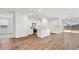 Spacious open-concept kitchen and living area with wood flooring at 5772 E Axle Ln, San Tan Valley, AZ 85140