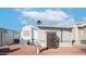 Brick-paved backyard area with utility shed and mature trees at 60 S Jacknife Dr, Apache Junction, AZ 85119
