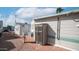 Brick-paved backyard area with utility shed and mature trees at 60 S Jacknife Dr, Apache Junction, AZ 85119