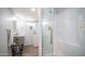Bright bathroom with a glass-enclosed shower, vanity sink, in-unit washer-dryer, and linen storage at 60 S Jacknife Dr, Apache Junction, AZ 85119