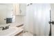 Bathroom featuring a sink, mirror, toilet, and shower with curtain at 60 S Jacknife Dr, Apache Junction, AZ 85119