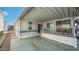 Exterior view of a charming mobile home showcasing an inviting covered patio with convenient built-in storage at 60 S Jacknife Dr, Apache Junction, AZ 85119