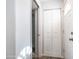 Hallway with a closet, access to other rooms, and neutral wall coloring at 60 S Jacknife Dr, Apache Junction, AZ 85119