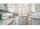 Bright kitchen featuring a gas range, microwave, wood-look countertops and ample cabinetry at 60 S Jacknife Dr, Apache Junction, AZ 85119