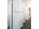 A view of the kitchen with a white refrigerator and cabinets lining the wall at 60 S Jacknife Dr, Apache Junction, AZ 85119