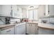 Well-maintained kitchen with gas range, microwave, wood-look countertops, and window at 60 S Jacknife Dr, Apache Junction, AZ 85119