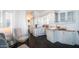 Bright, eat-in kitchen featuring updated appliances, white cabinetry and a cozy seating area by the window at 60 S Jacknife Dr, Apache Junction, AZ 85119