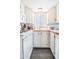 A well-lit kitchen featuring white appliances, cabinets, and countertops at 60 S Jacknife Dr, Apache Junction, AZ 85119