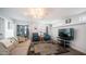 Spacious living room with a large rug and a sliding glass door at 60 S Jacknife Dr, Apache Junction, AZ 85119