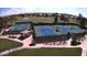 Aerial view of the community tennis courts with well-maintained grounds and lighting at 6460 S Springs Pl, Chandler, AZ 85249