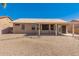 Relaxing backyard with gravel, desert landscaping, and a covered patio at 6460 S Springs Pl, Chandler, AZ 85249