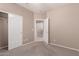 Neutral bedroom features carpet flooring, large closet, and adjoining door at 6460 S Springs Pl, Chandler, AZ 85249