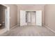 Spacious bedroom with an ensuite bathroom accessible through white double doors at 6460 S Springs Pl, Chandler, AZ 85249