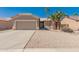 Charming single-story home featuring desert landscaping, a two-car garage, and a welcoming entrance at 6460 S Springs Pl, Chandler, AZ 85249