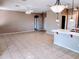 Spacious living room with tile flooring and a view of the kitchen and adjacent dining area at 6460 S Springs Pl, Chandler, AZ 85249