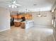 Open-concept living space featuring a combined living room, dining area, and kitchen with a center island at 6460 S Springs Pl, Chandler, AZ 85249