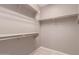 Walk-in closet with shelving and hanging rods at 6460 S Springs Pl, Chandler, AZ 85249