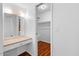 Bathroom vanity with a lighted mirror and walk-in closet at 6707 N 42Nd Ave, Phoenix, AZ 85019