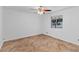Clean, bright bedroom featuring tile floors, a ceiling fan, and a window with a view at 6707 N 42Nd Ave, Phoenix, AZ 85019