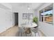 Bright dining room featuring a modern table, elegant decor, and a ceiling fan, creating a cozy space for meals at 6707 N 42Nd Ave, Phoenix, AZ 85019