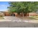 Charming single-story home featuring a covered carport and mature shade tree in the front yard at 6707 N 42Nd Ave, Phoenix, AZ 85019