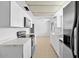 Modern kitchen with white cabinets, stainless steel appliances, and tile floors at 6707 N 42Nd Ave, Phoenix, AZ 85019