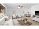Open-concept living space featuring neutral decor, stylish seating, and a dining area, perfect for modern living and entertaining at 6707 N 42Nd Ave, Phoenix, AZ 85019