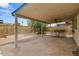 Large covered patio featuring a built-in grill station and ample space for seating at 6707 N 42Nd Ave, Phoenix, AZ 85019