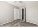 Neutral bedroom featuring plush carpet, ceiling fan and large closet for ample storage at 6713 S Jentilly Ln, Tempe, AZ 85283