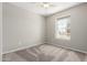 Bright and airy bedroom featuring carpet and a large window with natural light at 6713 S Jentilly Ln, Tempe, AZ 85283