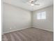 This light filled bedroom features neutral walls, plush carpet and a window at 6713 S Jentilly Ln, Tempe, AZ 85283