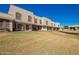 Community of townhouses with mature trees, landscaped lawns, and inviting exteriors at 6713 S Jentilly Ln, Tempe, AZ 85283