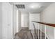 Hallway features multiple closets and neutral colored walls and plush carpet at 6713 S Jentilly Ln, Tempe, AZ 85283