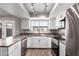 Updated kitchen with stainless steel appliances and views out the back window at 6713 S Jentilly Ln, Tempe, AZ 85283