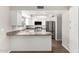 Bright kitchen featuring white cabinets, stainless steel appliances, and laminate countertops at 6713 S Jentilly Ln, Tempe, AZ 85283