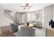 Bright living room featuring a ceiling fan, modern furniture, and hardwood floors at 6713 S Jentilly Ln, Tempe, AZ 85283