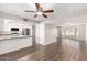 Open-concept living room and kitchen featuring tile floors, neutral paint, stainless appliances at 6713 S Jentilly Ln, Tempe, AZ 85283