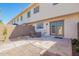 Enclosed patio featuring a small seating area, gravel landscaping, and access to the home's entrance at 6713 S Jentilly Ln, Tempe, AZ 85283