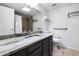 Bright bathroom with accessible features, single sink with granite countertops and a shower at 6729 E Sharon Dr, Scottsdale, AZ 85254