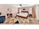 Cozy bedroom with a large rug, comfortable bed, a desk, and a blue chair at 6729 E Sharon Dr, Scottsdale, AZ 85254