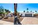 Inviting single-story home with desert landscaping, attached garage, and neatly paved driveway at 6729 E Sharon Dr, Scottsdale, AZ 85254