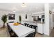 Open kitchen and dining area with a large island, breakfast bar, and ample seating at 6729 E Sharon Dr, Scottsdale, AZ 85254