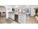 Open concept layout featuring a kitchen island with seating, stainless steel appliances, and access to living areas at 6729 E Sharon Dr, Scottsdale, AZ 85254