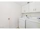 Bright laundry room with a white washer and dryer at 6729 E Sharon Dr, Scottsdale, AZ 85254
